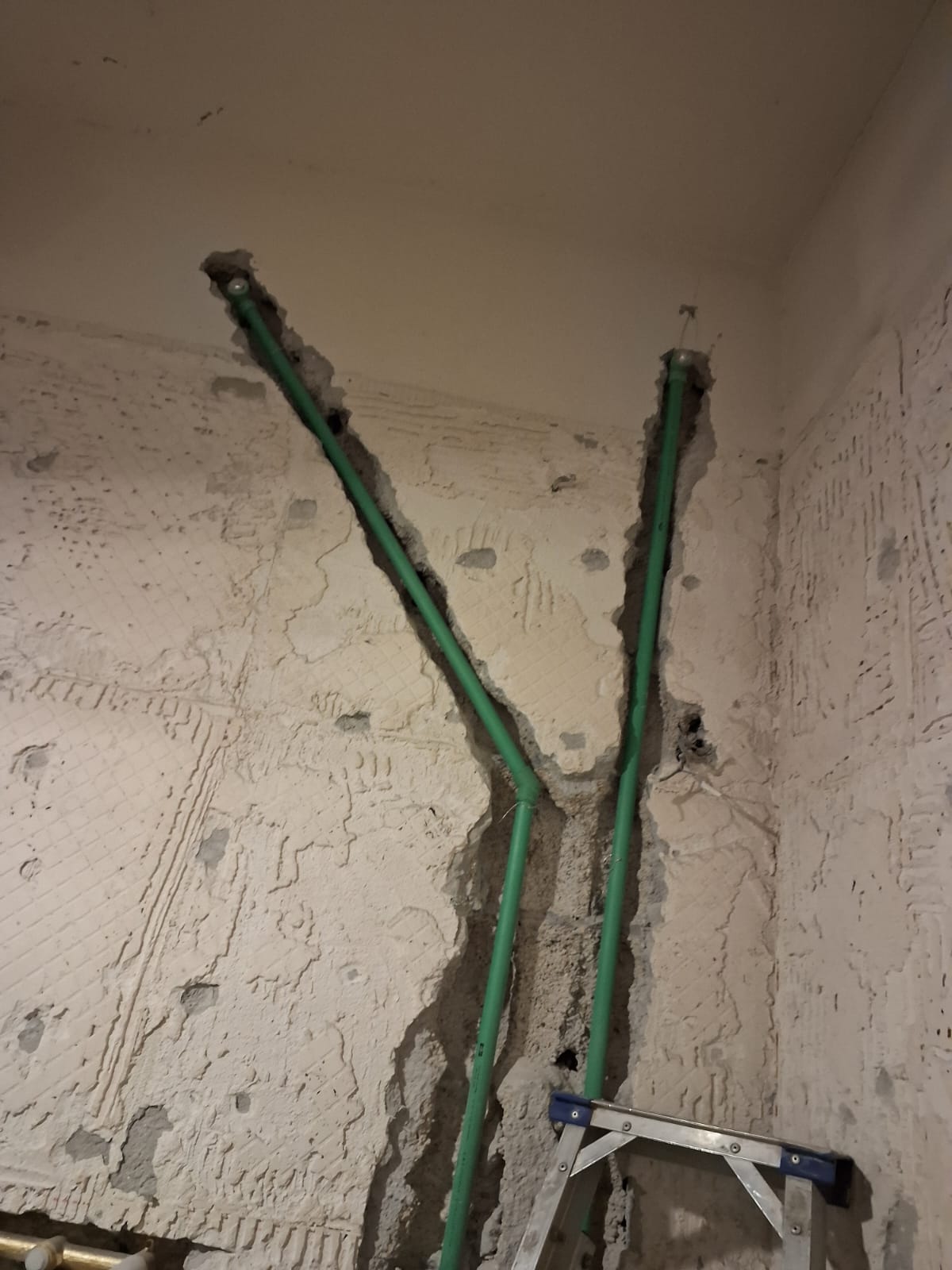 Water supply pipes routed to ceiling during a Sabbaq Fannan Al Riyadh drainage project